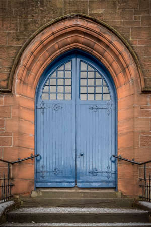 The entrance doorway to a church in the Scottish town of Clydebank.の写真素材