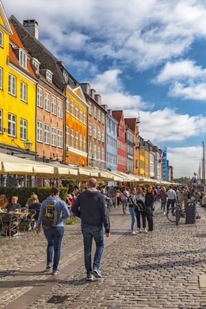 COPENHAGEN, DENMARK - SEPTEMBER 21, 2019: Copenhagen waterfront, canal and entertainment district lined by brightly colored 17th and 18th century townhouses.のeditorial素材