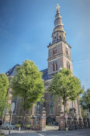 COPENHAGEN, DENMARK - SEPTEMBER 21, 2019: The Church of Our Saviour is a baroque, 17th-century place of worship with a carillon & steps around the outside of the spire.のeditorial素材
