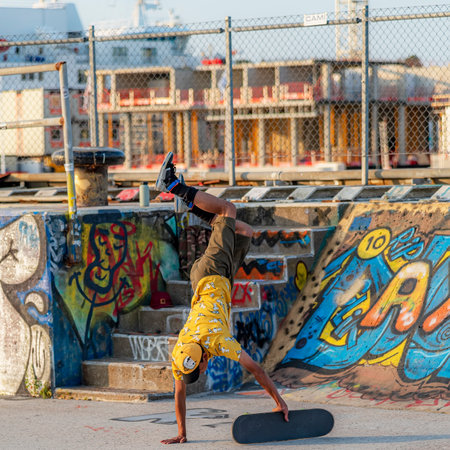 HELSINGBORG, SWEDEN - AUGUST 08, 2020: A young male doing tricks on his skateboard at the pixlapiren skate park in the city.のeditorial素材