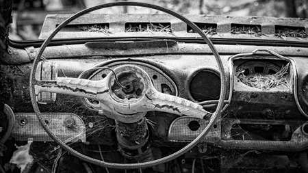 KIRKOE MOSSE, SWEDEN - 30 MAY 2020: A car graveyard situated in a forest at Kirkoe Mosse, Sweden.