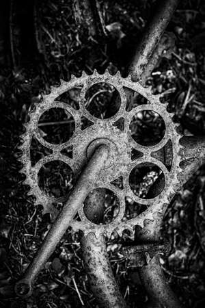 A close up of an abandoned bike at the car graveyard situated in a forest at Kirkoe Mosse, Sweden.のeditorial素材