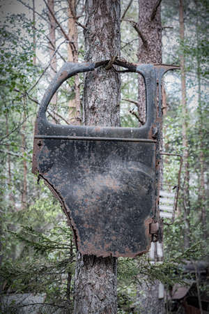 KIRKOE MOSSE, SWEDEN - 30 MAY 2020: A car graveyard situated in a forest at Kirkoe Mosse, Sweden.のeditorial素材