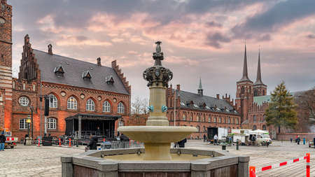 ROSKILDE, DENMARK - NOVEMBER 11, 2018: The Roskilde main square showing the town hall, fountain and...