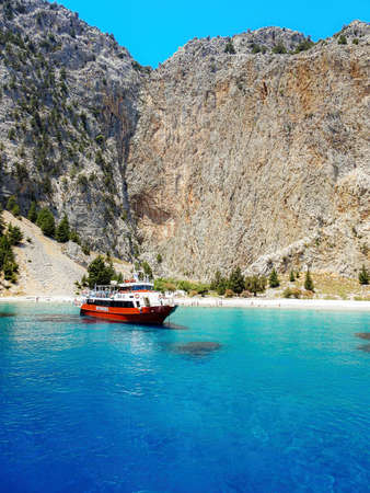 SYMI, GREECE - JULY 09, 2021: Saint George bay is a very popular stop over for tourists to have a swim in the turquoise watersのeditorial素材