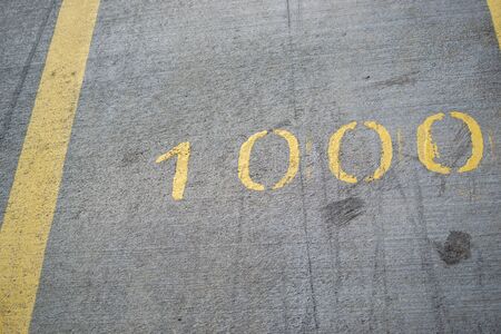 1000m distance mark on an asphalt running track