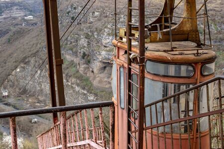 Red unique old cable car cabin at the top station on the mountain in Chiatura Canyonの写真素材