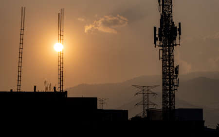 Buildings and Mountains Silhouette in the Afternoonの写真素材