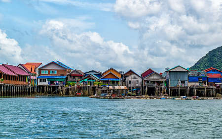 A small village of Floating houses near islands in Thailandの写真素材