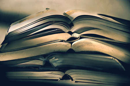 Heap of old books against white backgroundの写真素材