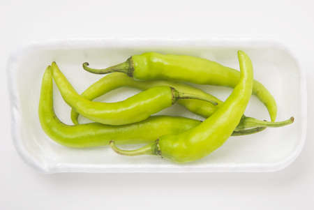 Chili green pepper on white background, shallow DOFの写真素材