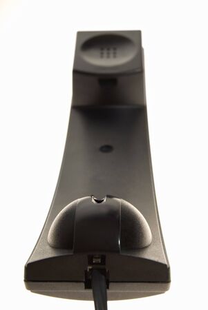 Studio shot of handset of black telephone