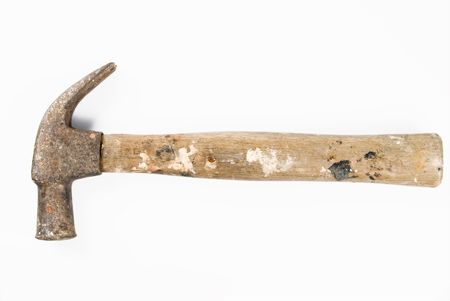 An old hammer against white backgroundの写真素材