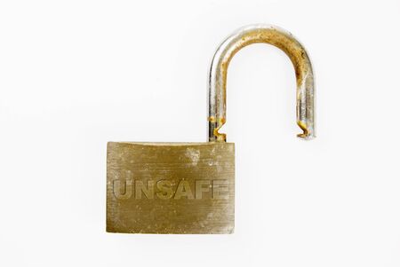 An unlocked rusted padlock against white background
