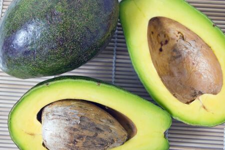 Avocado on wooden place mat
