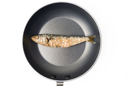 Studio shot of dried fish on small skillet の写真素材