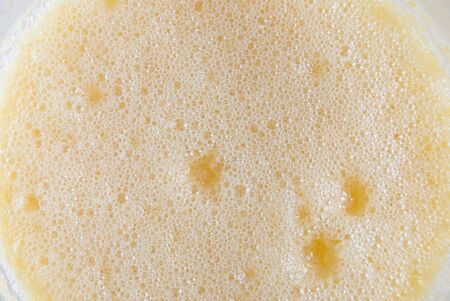 Closeup of froth of orange juiceの写真素材