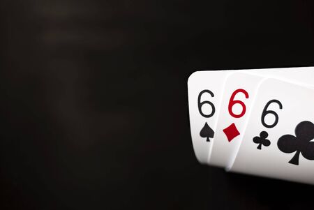 Three sixes against black backgroundの写真素材