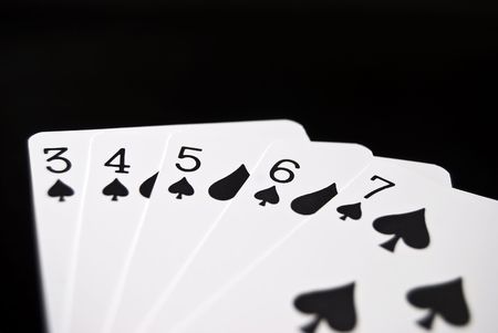 Straight cards against black backgroundの写真素材