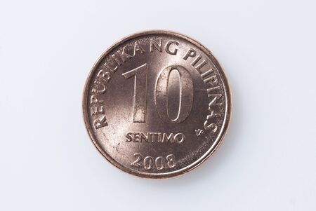Ten-centavo Philippine coin on white backgroundの写真素材
