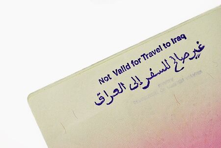 Open passport on white backgroundの写真素材