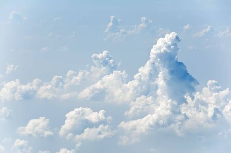 Fluffy clouds shot from airplane windowの写真素材