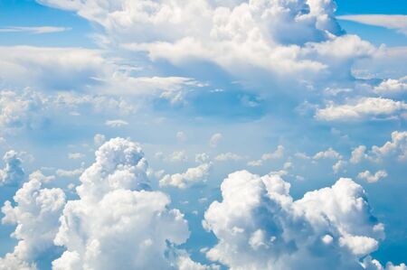 Fluffy clouds shot from airplane windowの写真素材