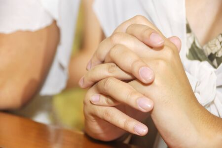 Hands of woman clasp in prayerの写真素材