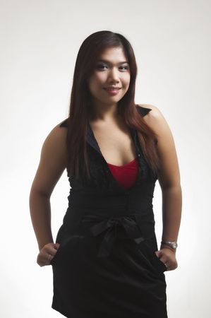 Young Asian female posing; shot against white backgroundの写真素材