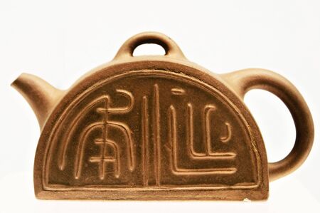 Ancient pottery from China made of ceramic; shot against white backgroundの写真素材