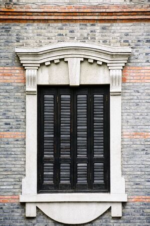 One big Victorian style window in an old residential areaの写真素材