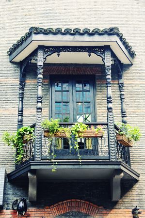 Old European window with plant box in Shanghai, Chinaの写真素材