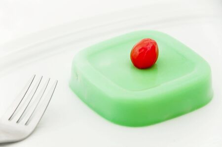 Close-up of Buko-Pandan (a Filipino dessert) with cherry on topの写真素材