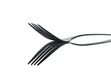 Close up of fork with reflection; isolated on whiteの写真素材