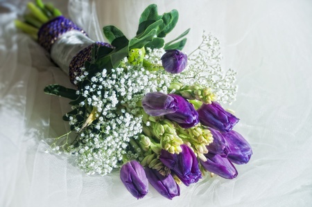 Wedding bouquet on veil of brideの写真素材