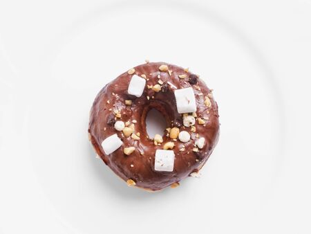 A temptingly delicious piece of donut with marshmallows
