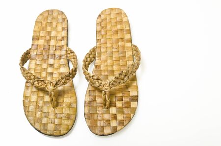 A pair of woven abaca slippers on white backgroundの写真素材