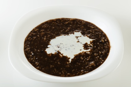 Chocolate rice porridge with milk on white bowlの写真素材