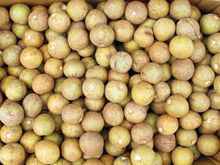 Box of chico fruit for sale in market