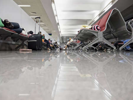 Gensan, Philippines - March 21, 2011: Tired and slleepy passengers waiting for their flight to Manila.のeditorial素材