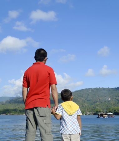 Father and son in Taal Lake during bonding momentの写真素材