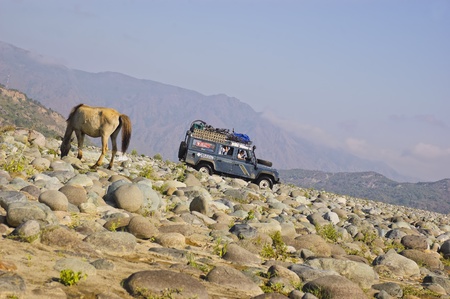 A Land Rover Defender crosses a long, dry river in the province of Quirino, Philippinesのeditorial素材