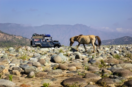 A Land Rover Defender crosses a long, dry river in the province of Quirino, Philippinesのeditorial素材