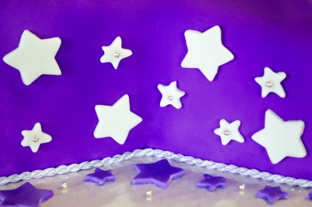 Closeup of violet cake decorated with white starsの写真素材