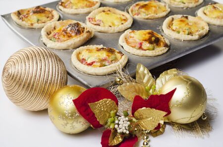 Close up of freshly baked Christmas vegetable and cheese tartの写真素材