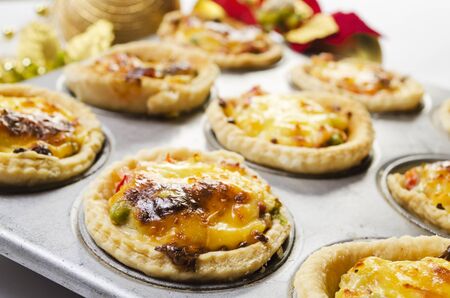 Close up of freshly baked Christmas vegetable and cheese tartの写真素材