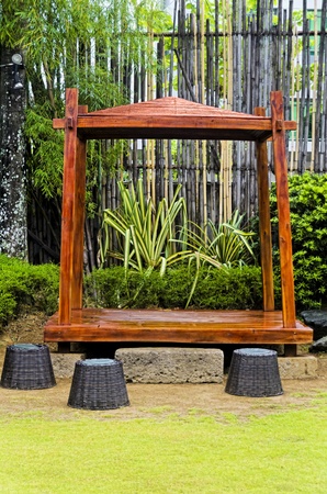 Gazebo with rattan stools in a city gardenの写真素材