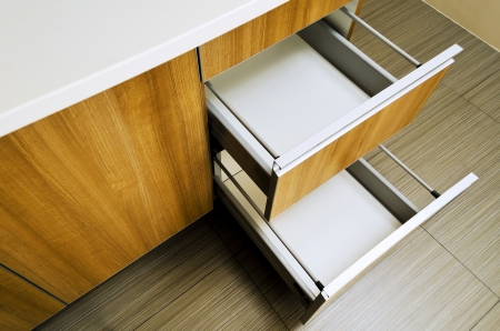 Open and empty kitchen drawers shot from aboveの写真素材
