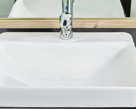 Close-up of lavatory faucet in a newly constructed houseの写真素材