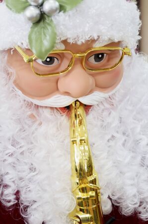 Close-up of Santa Claus playing musical instrument の写真素材